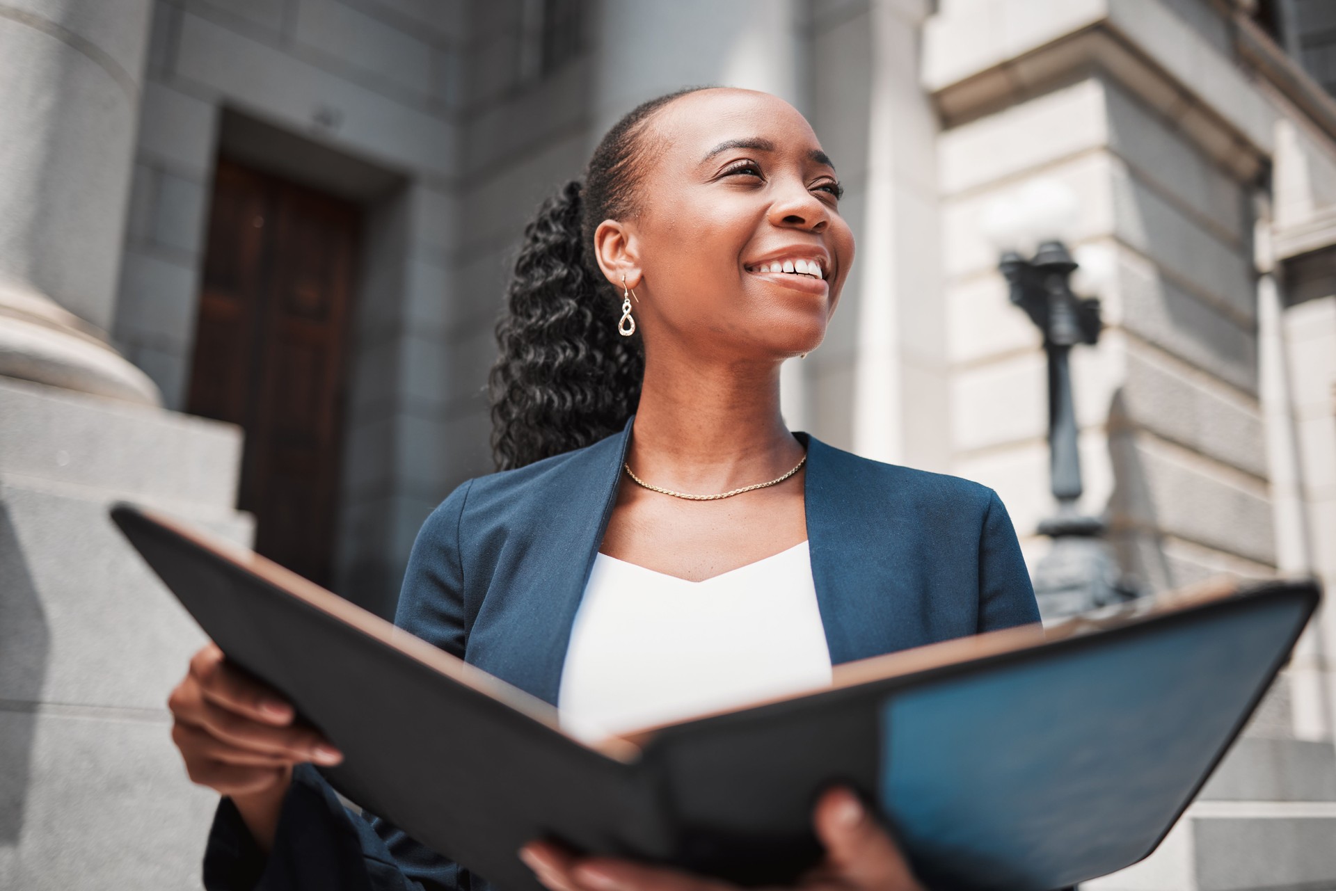 Book, black woman or lawyer thinking of education, legislation or constitution research by law firm. Reading, studying or happy attorney with knowledge, ideas or vision for legal agency by court